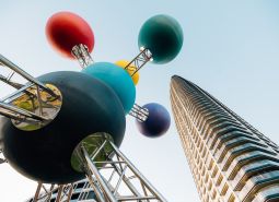 Colorful sculpture and modern high-rise building, Residential construction.