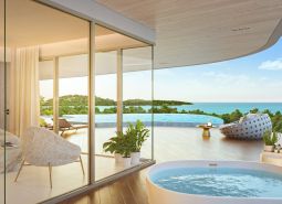 Elegant interior with a view of the terrace, pool, and ocean, Apartment construction.