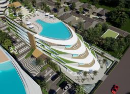 Apartment construction in Phuket with rooftop pools and tropical greenery.
