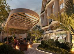 Construction of apartments on Paje Street in Unguja South with illuminated outdoor seating and greenery.