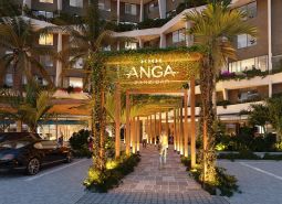 Apartment construction in Paje, Unguja South, illuminated entrance gates surrounded by greenery.