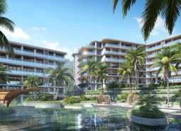 Apartment construction with a pool and palm trees in the city of Phuket.