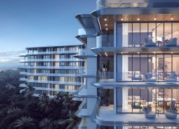 Apartment construction in Phuket with balconies overlooking the beach and sea.