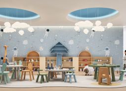 Interior of a children's playroom with a space theme and a wooden decor floor.