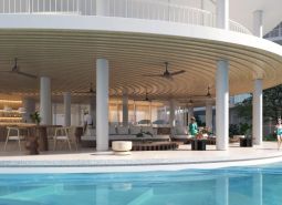 Poolside seating with a bar under construction in an apartment complex in Surat Thani.