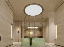 Reception in an apartment building with light decor and decorative curtains.
