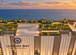 Apartment construction in Pattaya with a rooftop park and sea view.