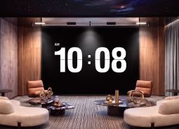 An interior space with clocks, sofas, and coffee tables as part of apartment construction.