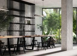 Interior with a long table, chairs, and large glass windows. Apartment construction.