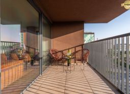 Balcony of apartment construction with seating and a view of Bratislava - Ružinov, Mierová.