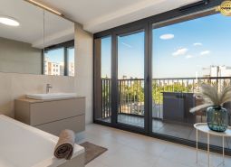 Bathroom with a view and balcony, apartment construction, floor with wood decor.
