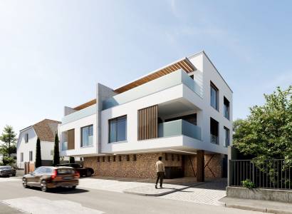 Construction of apartments on Kuzmányho Street in Trenčín with modern architecture and parking.