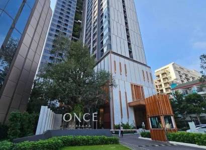 Apartment construction in Pattaya with high-rise buildings and landscaped green surroundings.