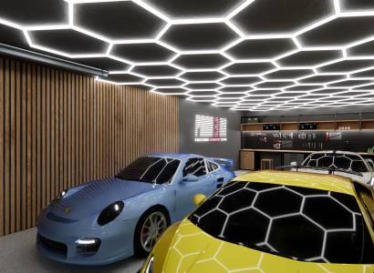 Commercial spaces with parked sports cars and modern ceiling lighting.