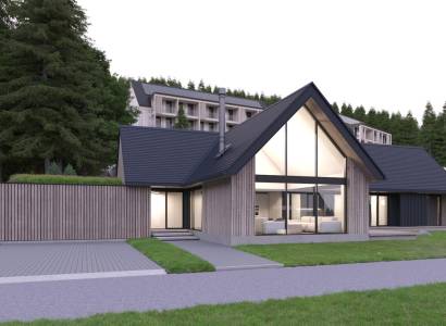 Modern architecture at development plots in Tajov, surrounded by a wooded environment.