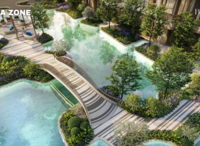 Apartment construction in Phuket: Garden with lagoon and bridge, landscaped greenery, water features.