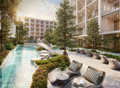 The construction of apartments in Phuket with a pool and greenery creates a relaxing environment.