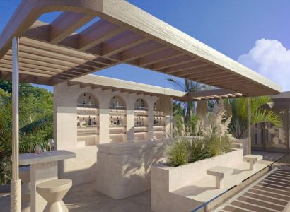 In Nungwi, there is a terrace with a bar in the villa, surrounded by palm trees and greenery.