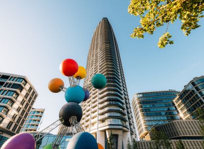 A high-rise building with a colorful sculpture on Pribinova Street in Bratislava - Old Town.