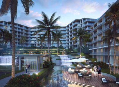 Apartment construction in Phuket with a terrace, palm trees, and an illuminated complex.