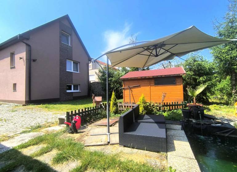 A family house in Nitrica with a garden seating area and a gazebo.