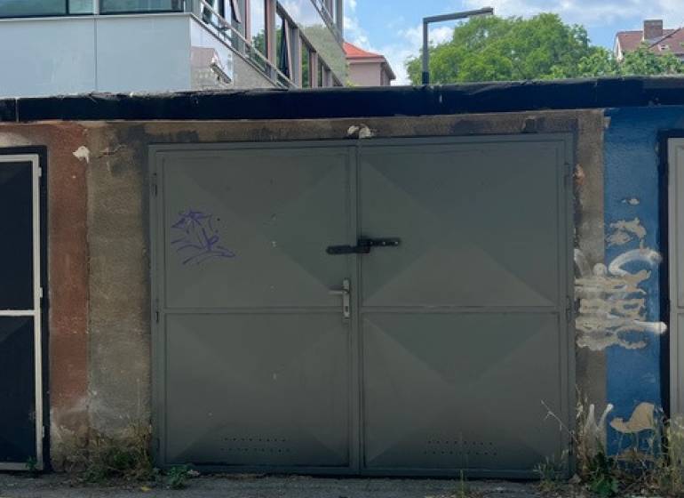 Garages on Budovateľská Street in Bratislava-Ružinov, in the middle of a clear summer day.