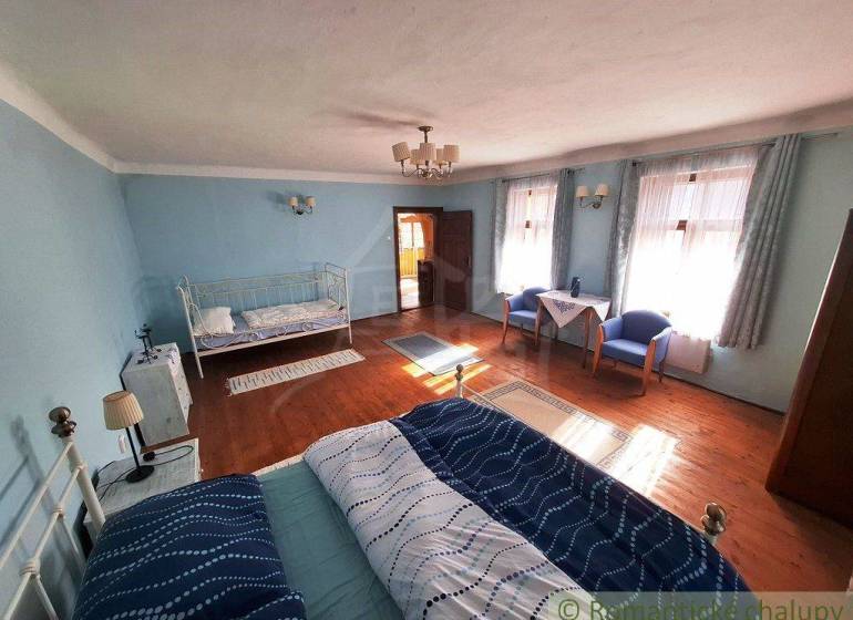 A room in blue color with a bed, properties with a unique interior.