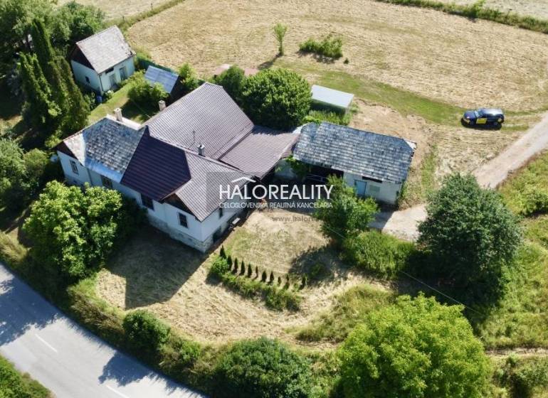 A family house in Ploské surrounded by nature and accessible via a road.