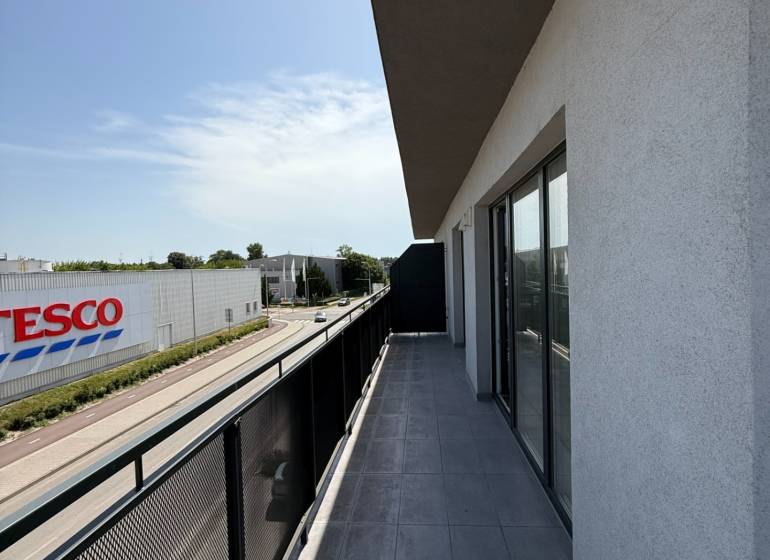Balcony of a 2-room apartment with a view of Pezinska Street in Malacky.