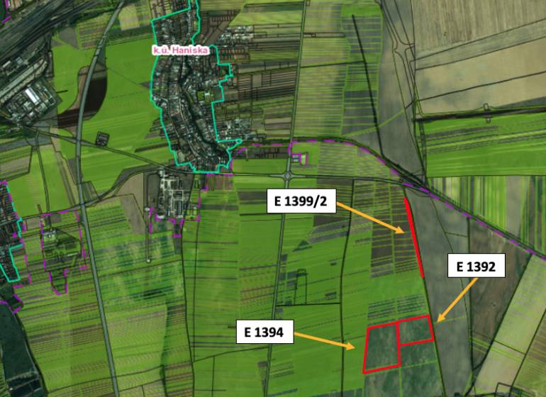 Aerial view of agricultural and forest land near Haniska, with marked parcels.