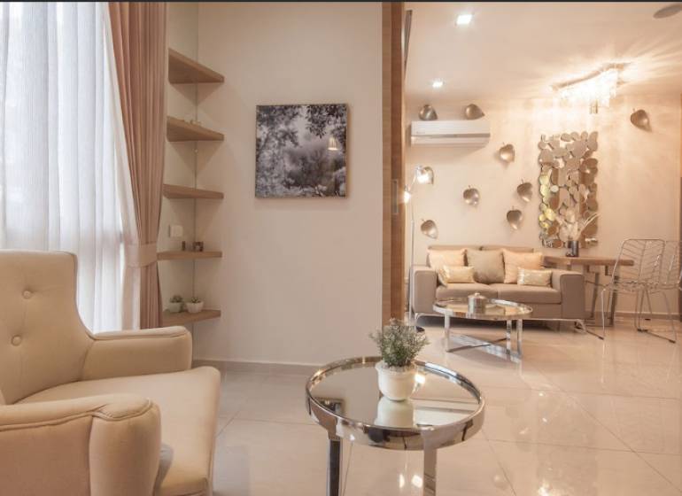 A stylish living space with a comfortable armchair and decorations in a two-room apartment.