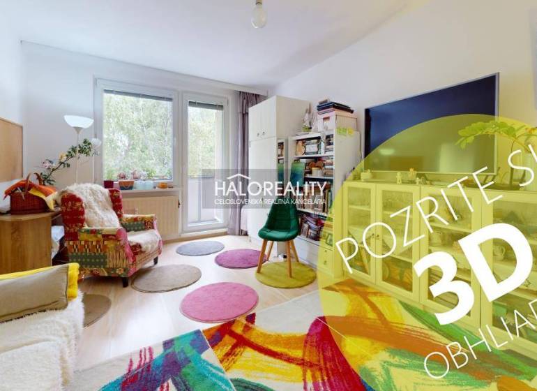 Living room with a light floor, colorful carpet, and comfortable seating in a four-room apartment.