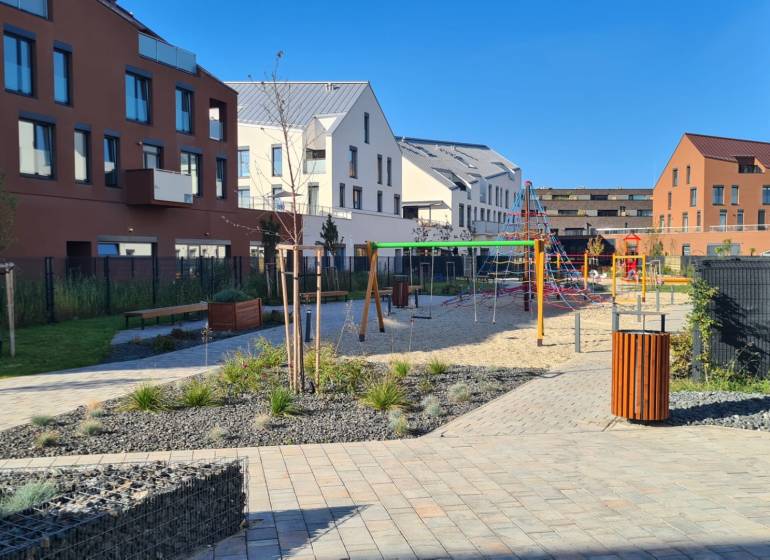 Courtyard with a playground between residential buildings on Perlová Street in Bratislava - Jarovce.