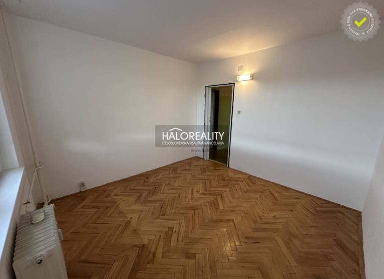 The entrance hall in a 3-room apartment with two open doors to the rooms.
