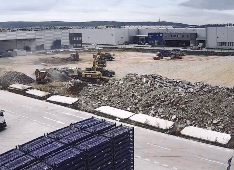 Construction site with machinery and debris in Bratislava - Devín, warehouses and halls.