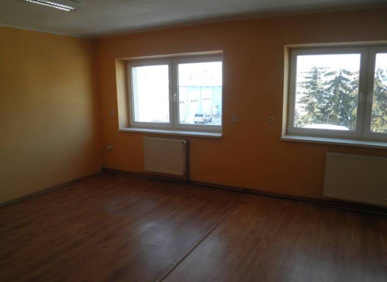 Empty room with wooden floor and windows in offices.
