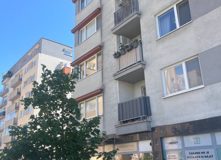 Apartment building on Lichnerova Street in Senec with commercial spaces and a parking lot.