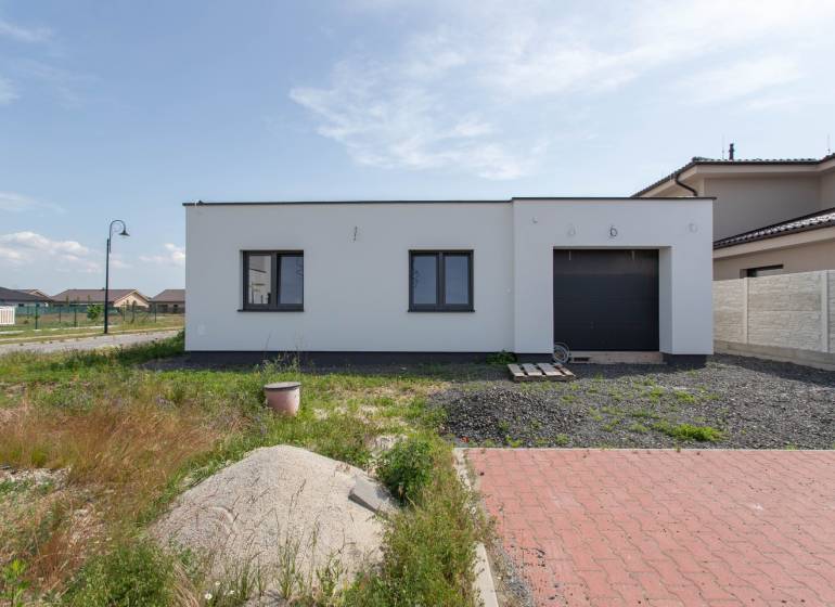 A family house in Zohor with a garden, garage, and driveway in a quiet suburb.