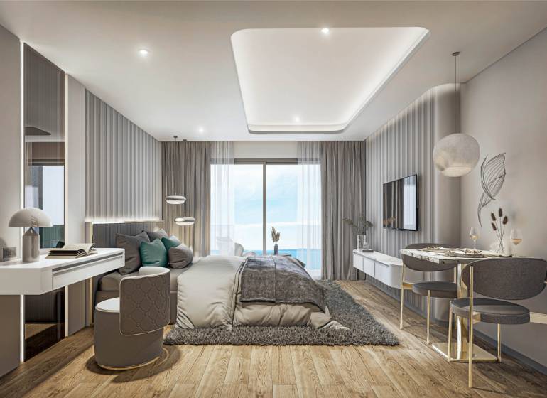 Luxury bedroom with ocean view within the apartment development.