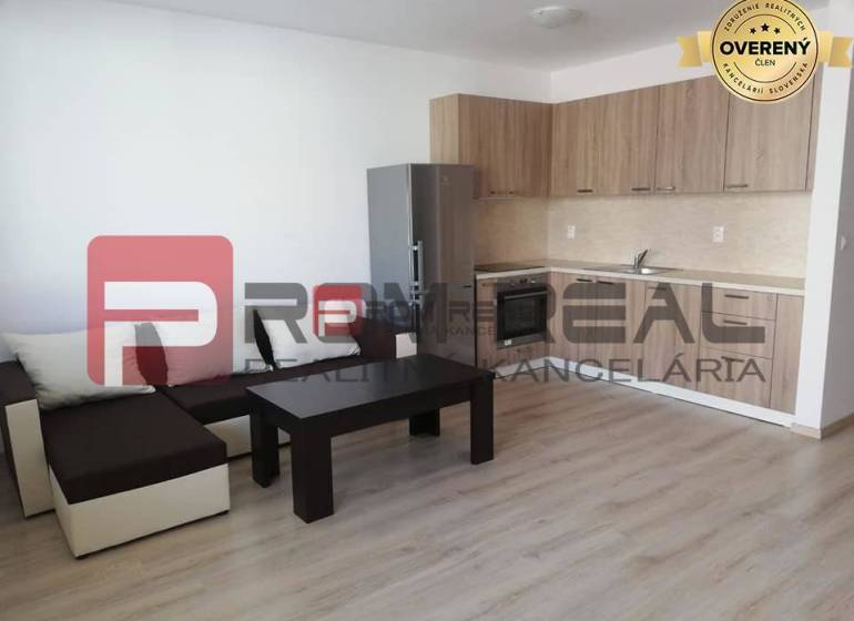 Living room on Slavomírova Street, 2-room apartment, kitchenette, sofa, table, wooden floor.