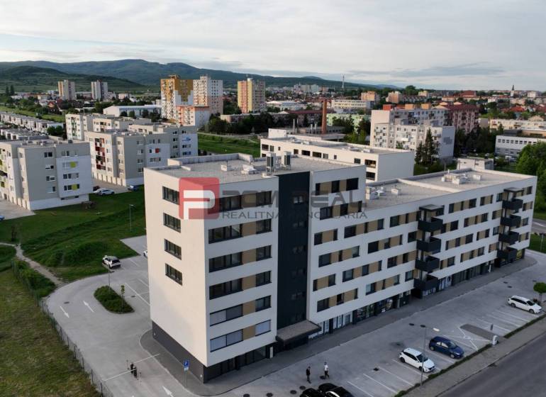 Commercial premises on Obchodná Street in Pezinok, surrounded by apartment buildings and greenery.