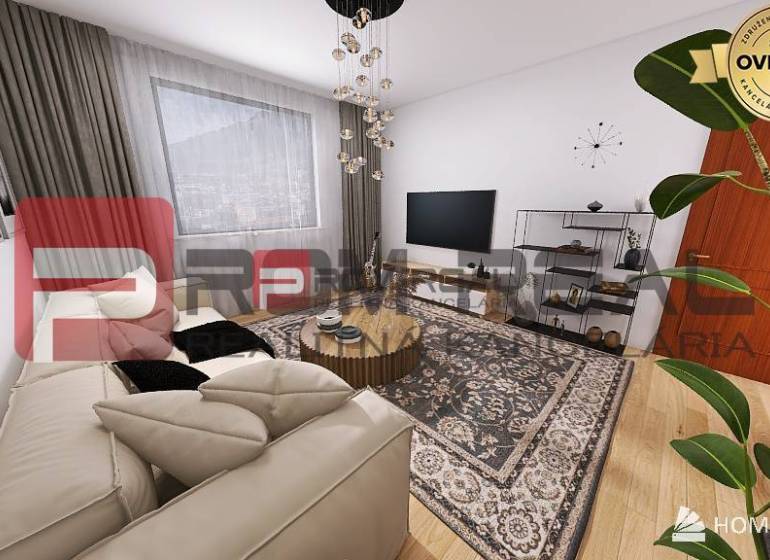 Living room with a sofa, decorative carpet, and TV in a 2-room apartment.