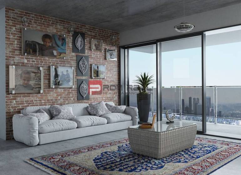 Living room of a 3-room apartment with a brick wall, sofa, carpets, and a balcony with a view.