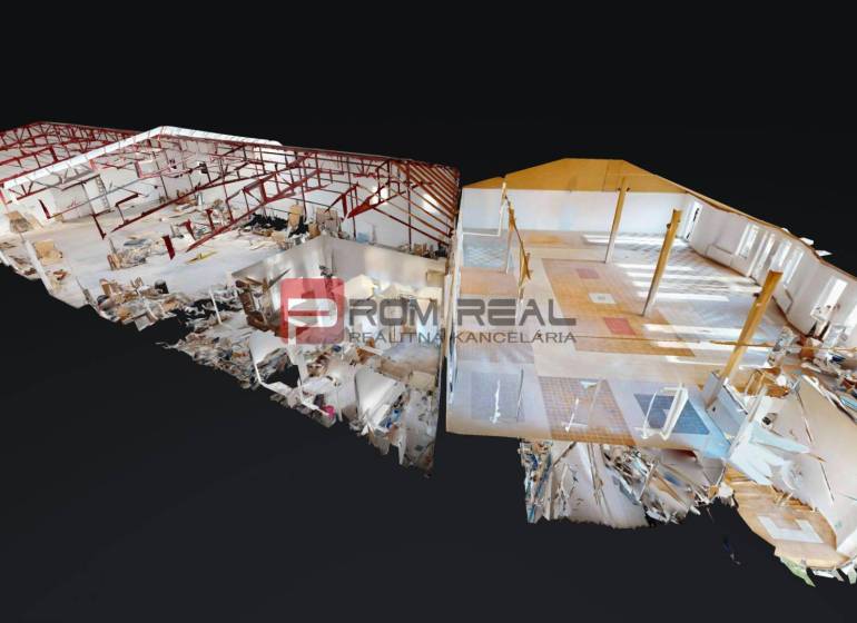 The interior of the building with open spaces, red frame structures, and diverse flooring.