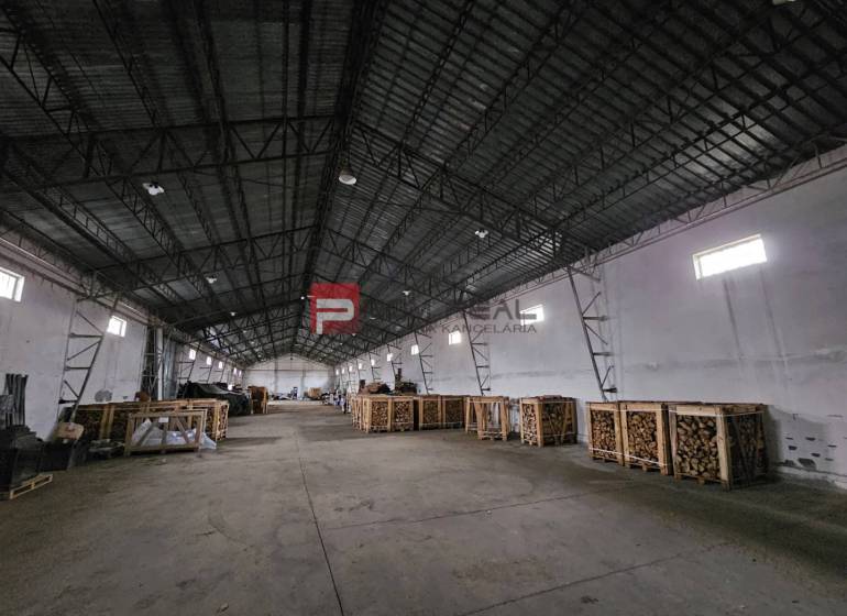 Space on Partizánska Street, designated for warehouses and halls, with stored pallets.