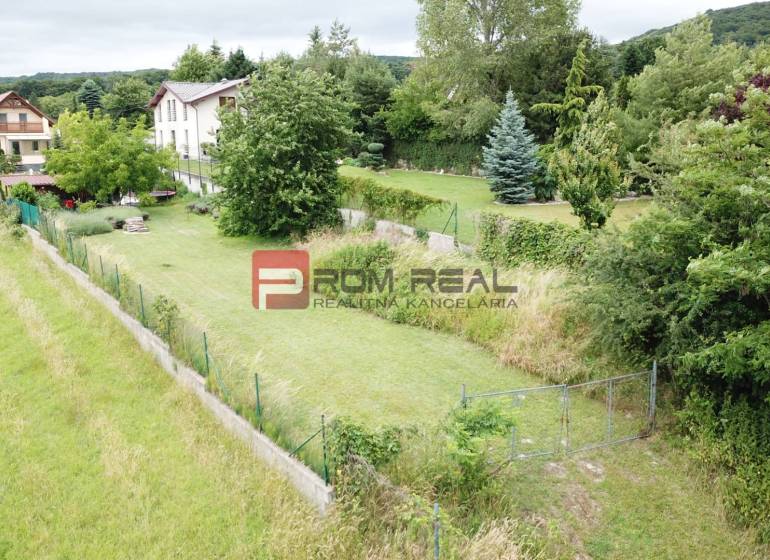 Plots - housing on Na Tálkoch Street in Marianka, surrounded by greenery and houses.