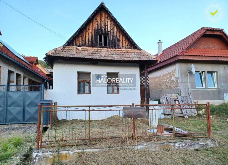 A family house in Ladzany with traditional architecture, a white facade, and a sloped roof.