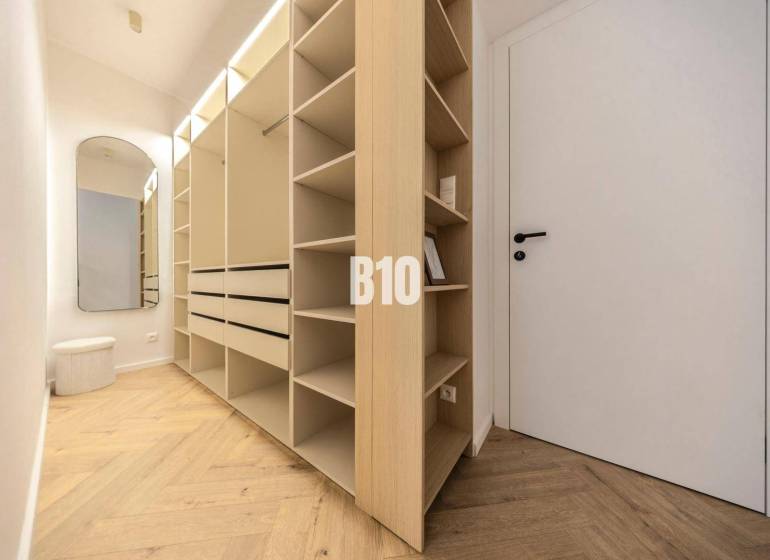 The picture shows a spacious wardrobe in a 3-room apartment on Benediktiho Street.