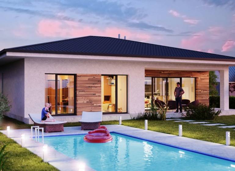 A cottage on Bratislavská Street in Pezinok with a pool and a terrace in evening lighting.