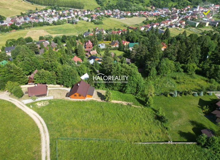 Aerial view of recreational plots in Vyšné Ružbachy surrounded by greenery and village houses.